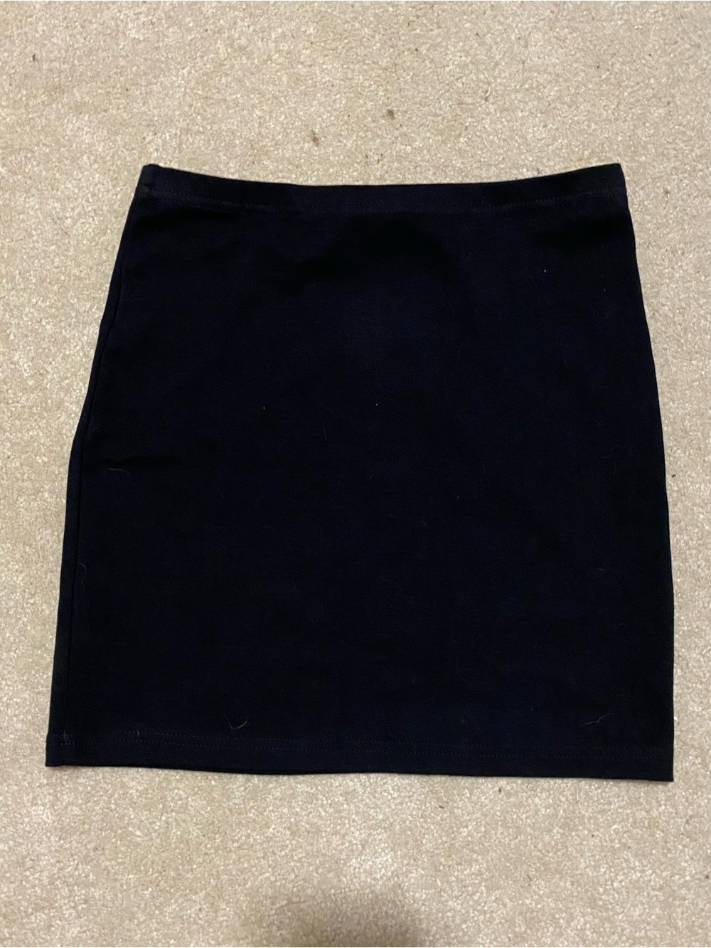Stretchy black mini skirt size 25-26 waist